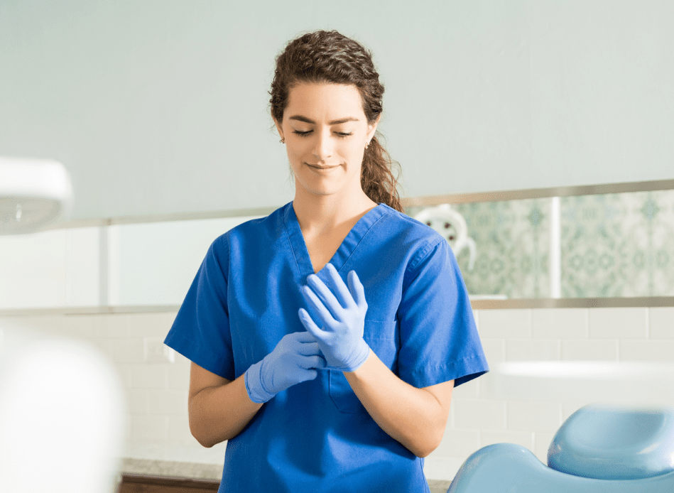 Dentist wearing surgical gloves