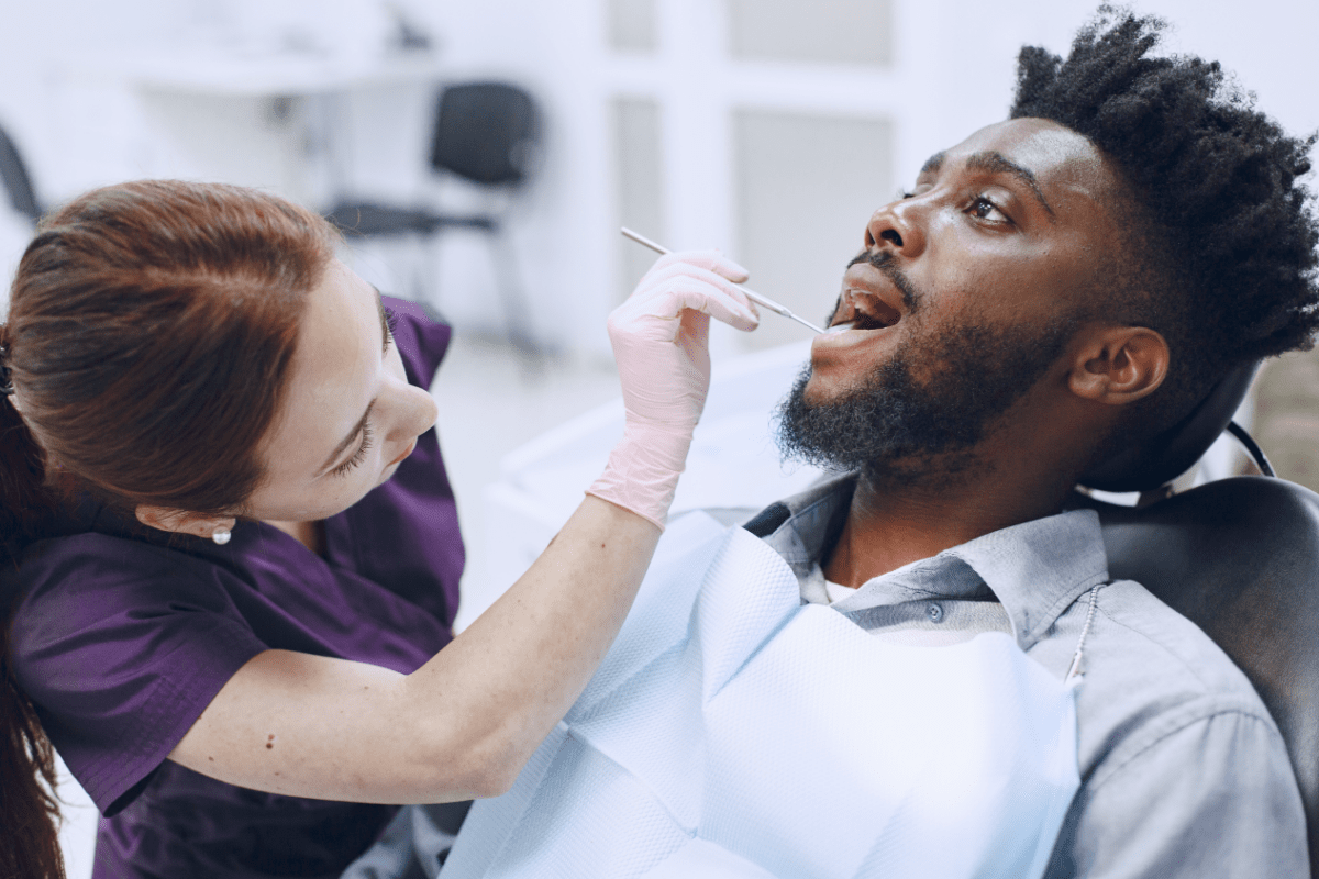 young man getting teeth checked