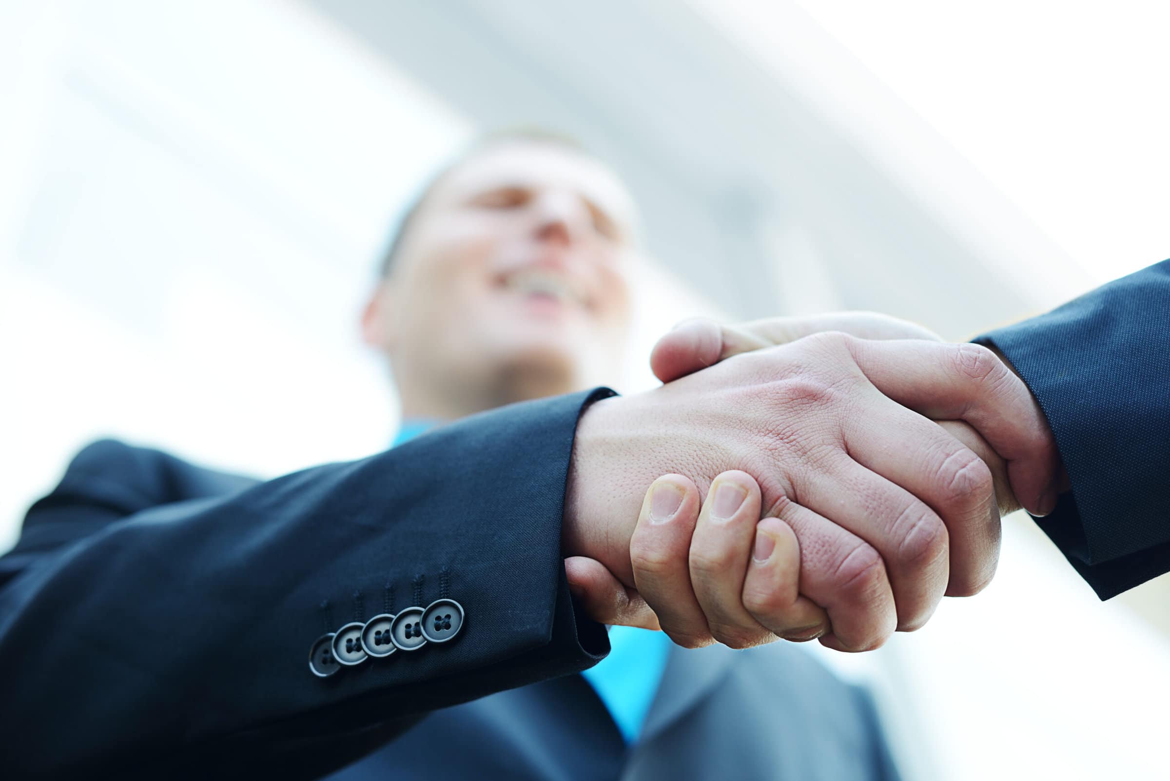 Business shaking hands with copy space (selective focus) Networking